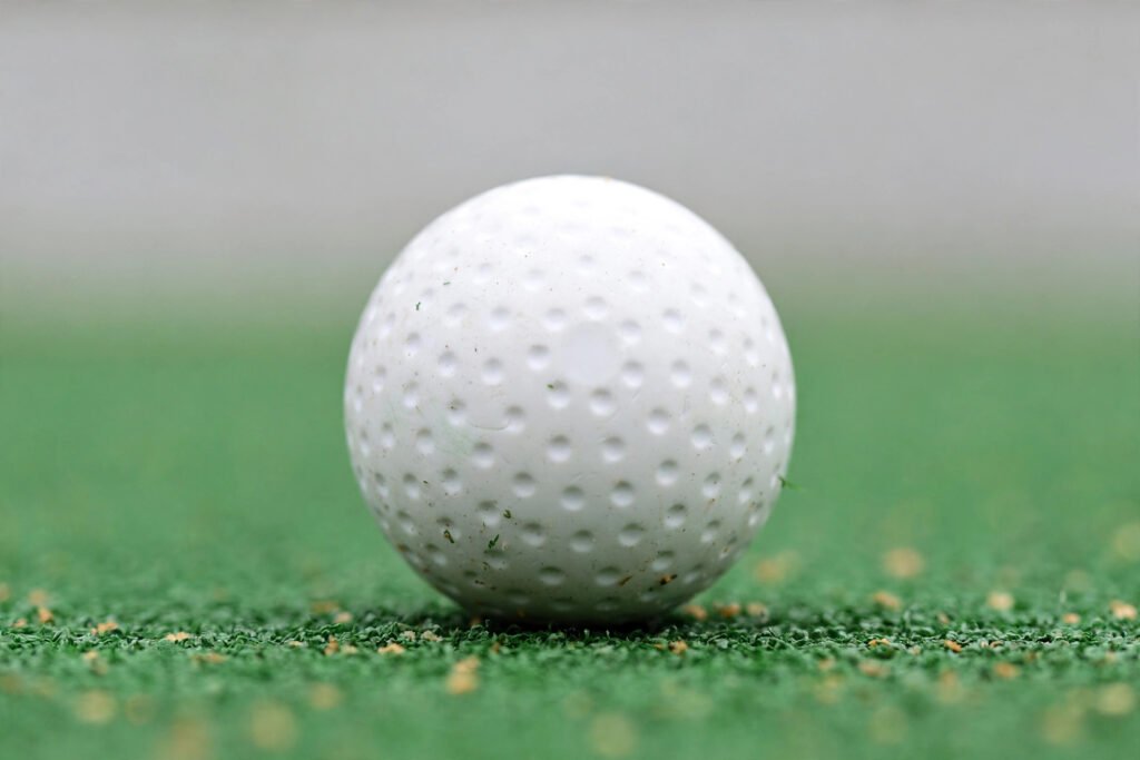Ball for hockey on a pitch, showing its smooth hard surface