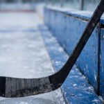 Ice hockey stick with shaft and blade on the ice
